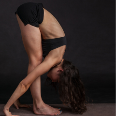 yoga forward fold, touching toes, yoga for flexibility